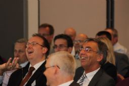 Delegates finding the funny side of the answers provided during the interactive voting session 